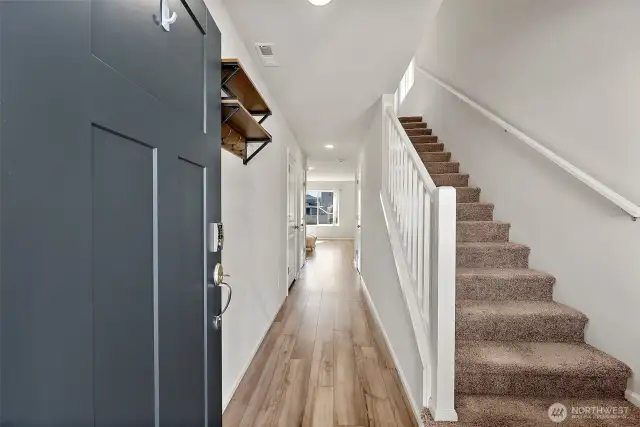 Large entry with stairs leading to the second floor.