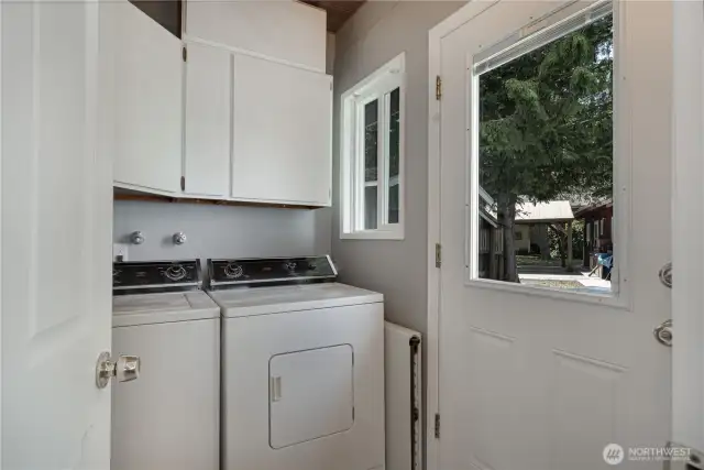 Walk into the laundry room.