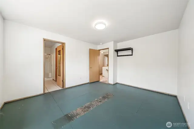 Primary bedroom with 3/4 bath and walk-in closet