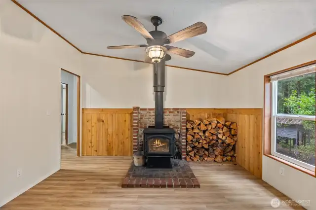 Efficient wood burning stove complete with plent of firewood to start off the cool season.