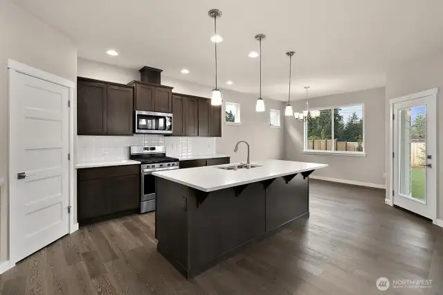 Home is under construction.  Photos are of a previously bult home in a different community with similar finishes.  Builder reserves the right to make changes to plans & specifications without notice.  Features vary by plan.  Buyer to verify square footage.