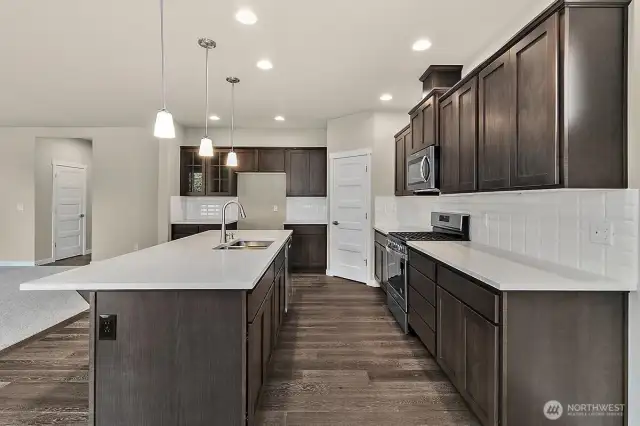 Home is under construction.  Photos are of a previously bult home in a different community with similar finishes.  Builder reserves the right to make changes to plans & specifications without notice.  Features vary by plan.  Buyer to verify square footage.