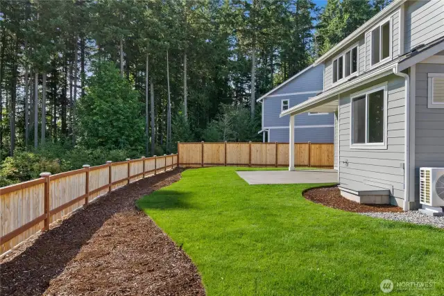Professionally landscaped front and back with privacy fencing.