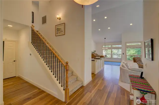 From the main entry looking in. Door to the left goes to the garage. Upstairs to the 3 bedrooms and full bathroom, straight to the kitchen, living room and dining room.