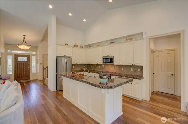 Main entrance, kitchen and hallway to the laundry room and primary suite.