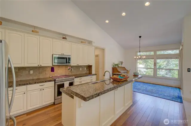 Kitchen and dining room with a sliding door to the covered rear deck.