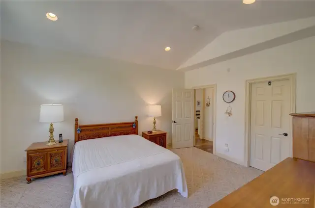 Primary Suite with walk in closet and full bath including jetted tub and shower. The closed door goes to the walk in closet.