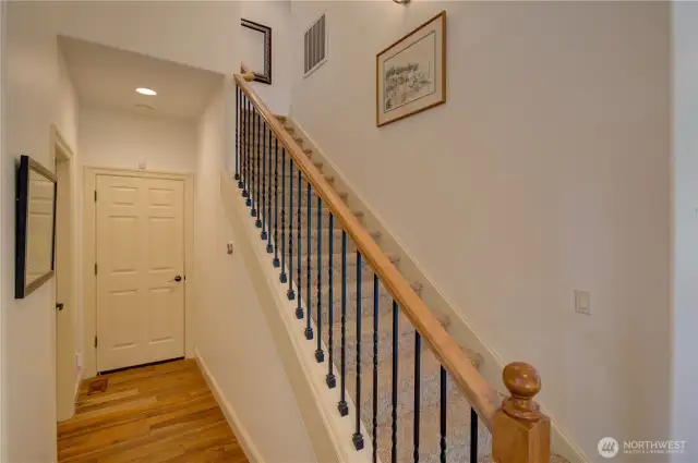 Hallway goes to the main floor half, garage and stairway to the second floor bedrooms.