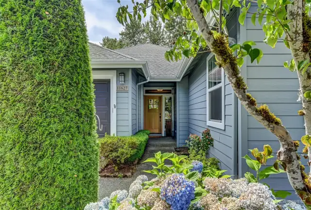 Over the past four years, the owner has remodeled the entire interior of this Whidbey plan home and your first glimpse is the gorgeous wood door.
