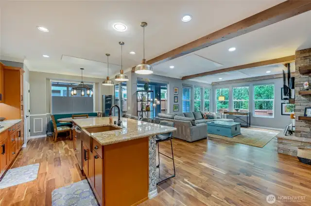 Wood beams add character to the great room and blend perfectly with the new stone fireplace.
