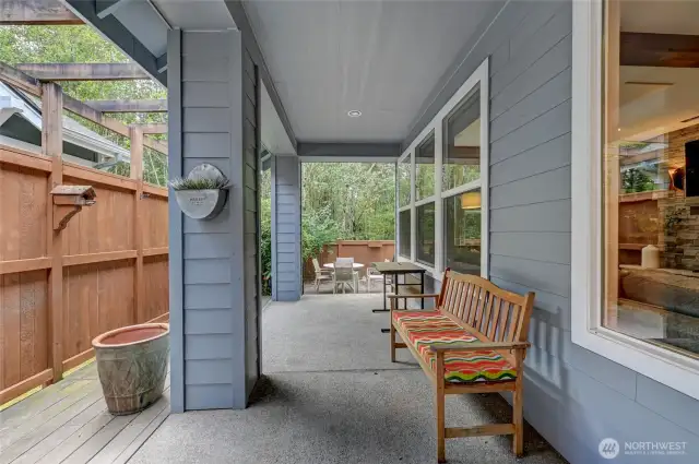 The covered patio can be used year round and leads down to the open patio and large deck.