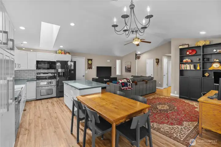 Updated Kitchen w/White Cabinets, Stainless and Black Appliances, Quartz Counters and Tile Backsplash