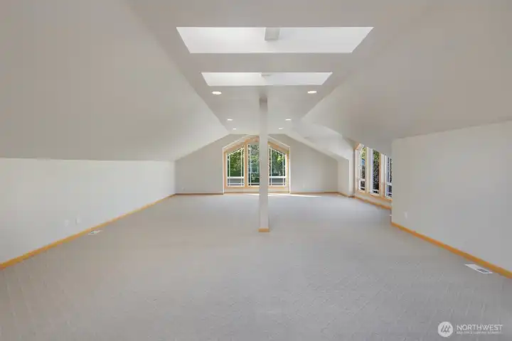 Bonus room is flooded with natural light (runs the total length of the 3 car garage)