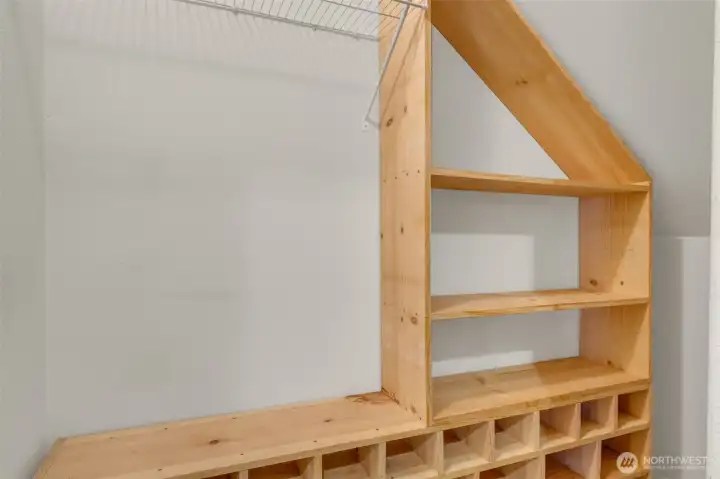 Great coat and shoe organization system in the entry hall closet.