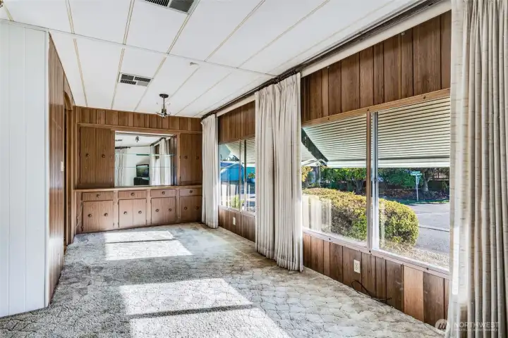 Dining room with generous windows and classic built-ins adds charm and function for shared meals and gatherings.