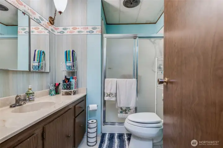Primary bath features a walk-in shower for comfort and easy accessibility.
