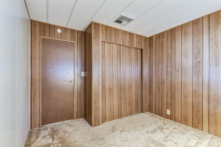 Bedroom two includes a roomy closet and soft natural light, creating a comfortable and functional space.