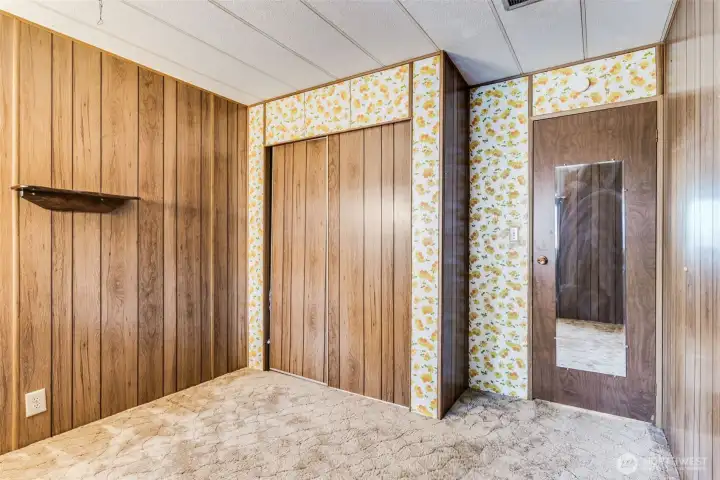 Bedroom three includes a full closet and built-in shelving for convenient storage and an inviting, organized feel.