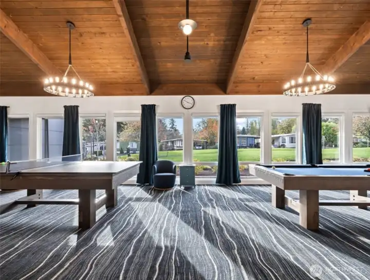 Whether it’s billiards or ping pong, enjoy the natural light and vibrant ambiance of this well-appointed game room.