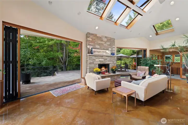 Truly a wow factor. Glass doors are open on both sides of fireplace.