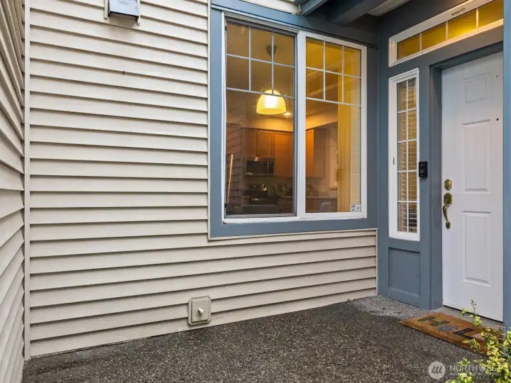 Down a long walkway, a private front porch is tucked in for added privacy from the street.