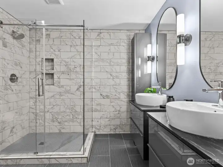 No detail was spared here. Keep your vanity top clean with the floor to ceiling cabinets next to each sink where you'll find outlets inside for hair tools and electronic toothbrushes.