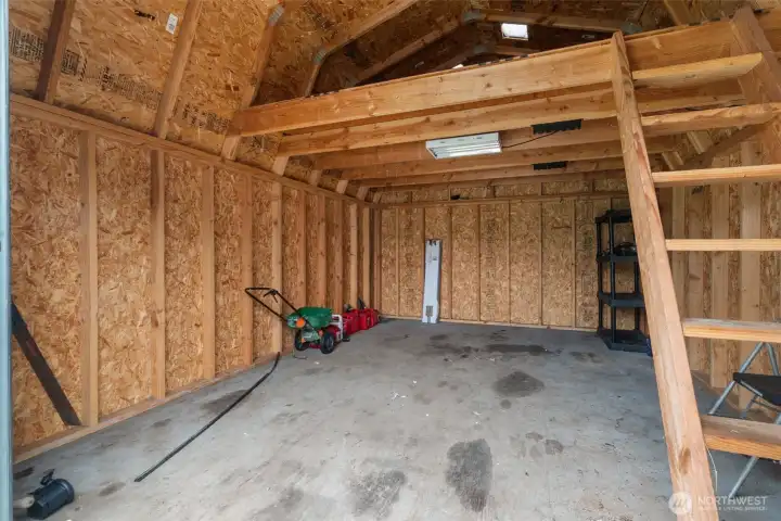 Work shop? She-shed? Or just extra storage with a convenient roll up door