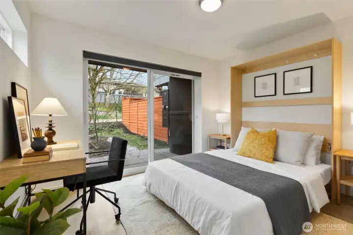 First floor bedroom with high-end murphy bed (bed conveys!) for easy transition from office to guest room.