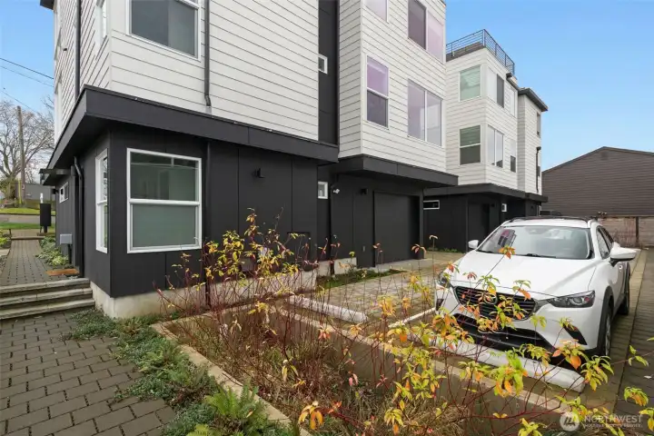 Parking for 2915 to the left of the white car. Lovely plantings throughout this well-maintained complex. There's also a storage space great for gear and seasonal items adjacent to the parking spot.
