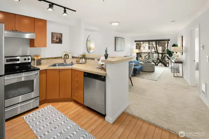 Open-concept kitchen connected to dinning and living areas