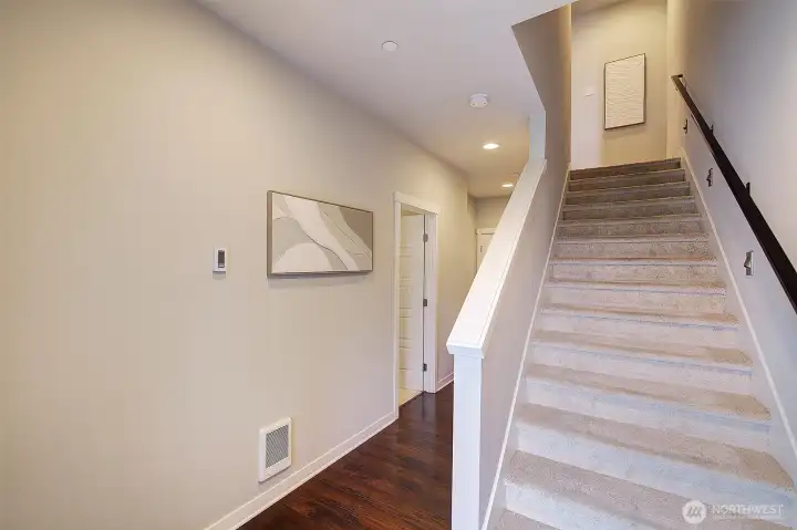 Main level features a good sized bedroom with three-quarter bath and can easily function as either guest quarters or an office.  Garage access is also available from this level.