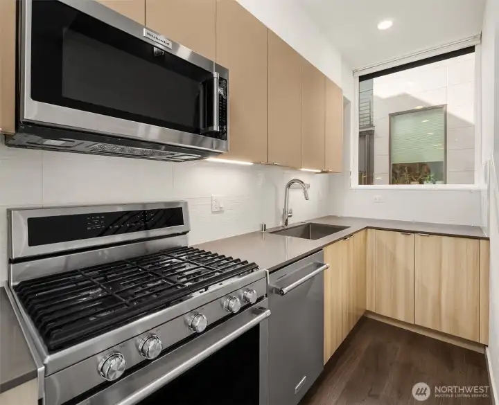 Bright kitchen with window framing the sink.