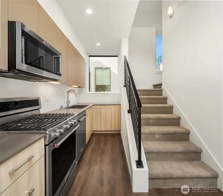 Bright kitchen with ample cabinet storage.