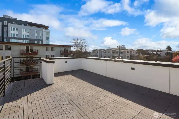 Rooftop deck with distant mountain views.