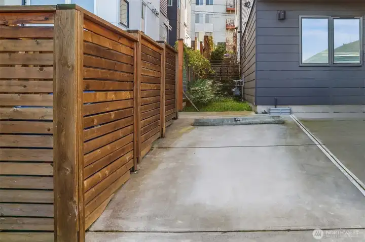 Reserved parking spot behind unit in lot.