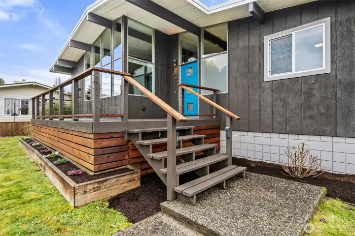 Stylish front steps & deck welcome you to the front porch.