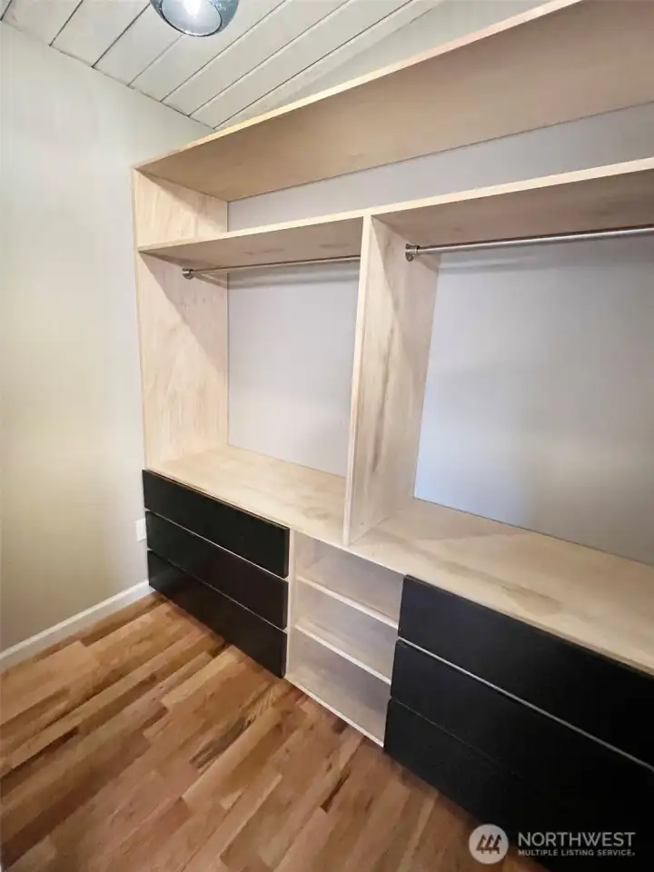 Walk in primary closet has custom built-in storage on both sides AND is plumbed for compact washer/dryer stack (full size laundry room in lower level).