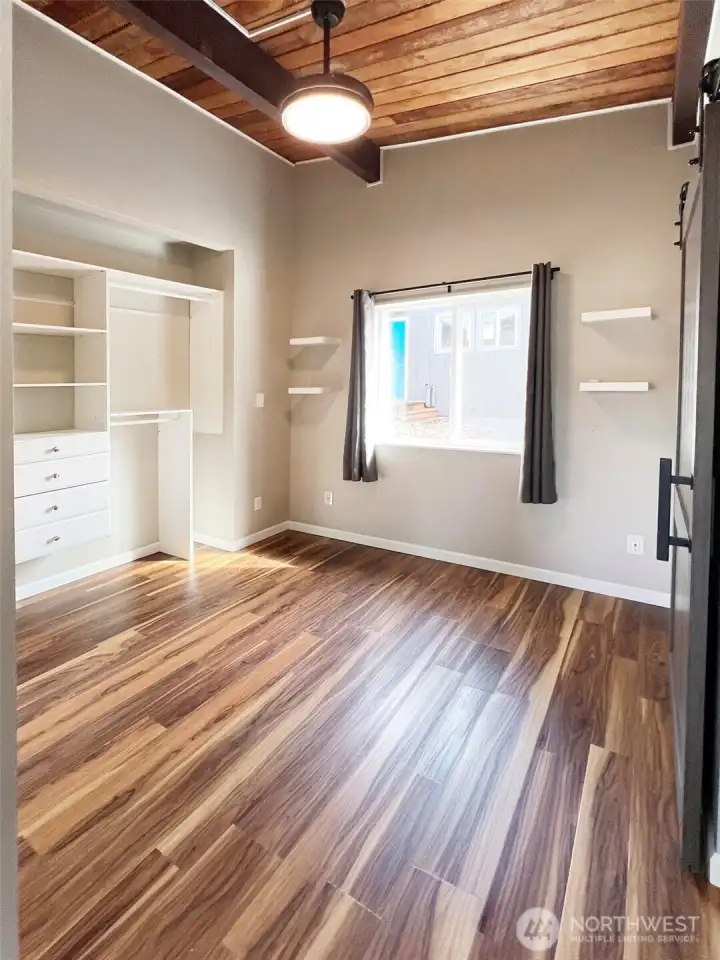 ADU bedroom with built in closet storage.