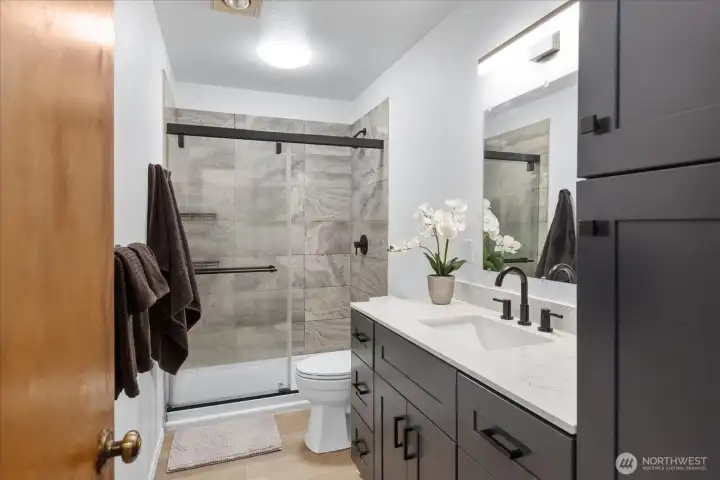 Lots of counter space and cupboards in this updated 3/4 bathroom.