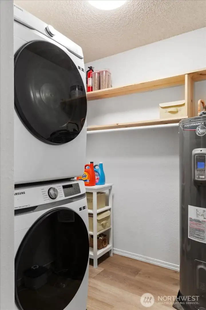 Newer Washer and Dryer in designated laundryroom.