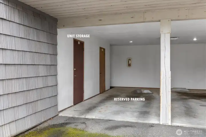 Undercover parking in back of building with more storage next to parking.