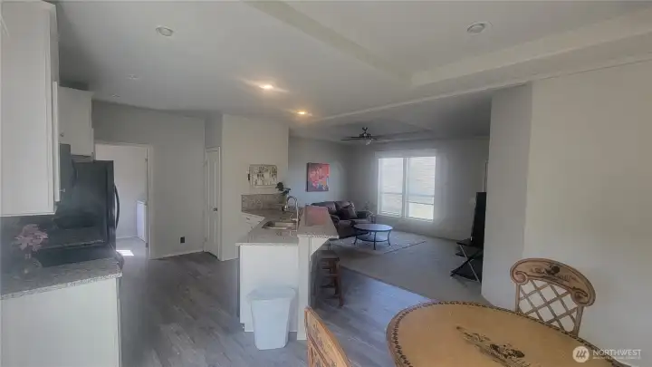 Dining room table next to kitchen