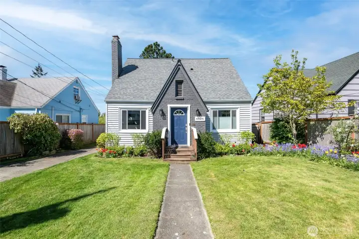 TurnKey home with quality construction and thoughtful updates – move in with confidence and minimal maintenance. Inviting layout features a spacious living room flowing into dining room & kitchen – ideal for everyday living and entertaining. Generous main-floor primary bedroom. Large utility/laundry room with built-in storage and convenient access to backyard.    Mature landscaping surrounds the home with established trees, shrubs, and seasonal blooms. Relax on the back patio under a green canopy all summer next to the outdoor stone fire pit. A dry, semi-finished basement offers flexible rec room / home gym space with fresh flooring.    Fully fenced property with 6' privacy fencing in back and black chain-link fencing with a remote-controlled rolling gate at the front. Deep driveway offers multiple off-street parking spots and leads to newer 14’x24’ detached garage with an extra tall ceiling offering generous storage options and accommodation for tall vehicles.    Roof and side sewer u