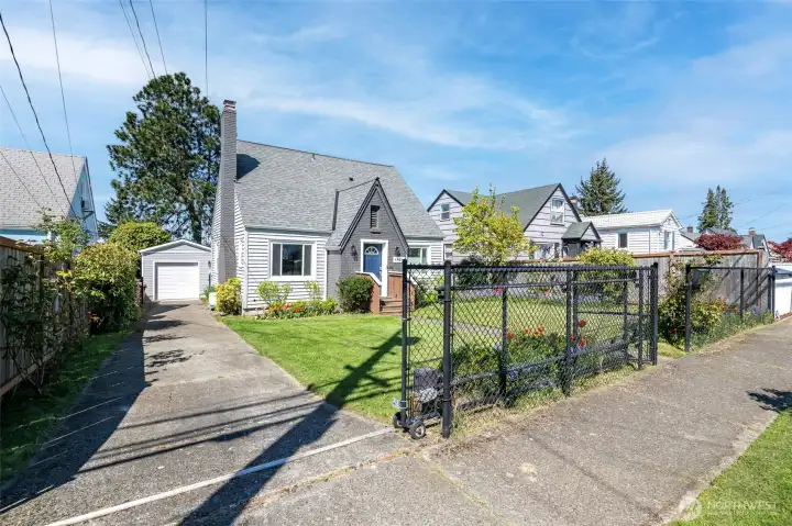 Fully fenced. Front is black chain link with an electric-motarized rolling gate with remote controls for your vehicles.