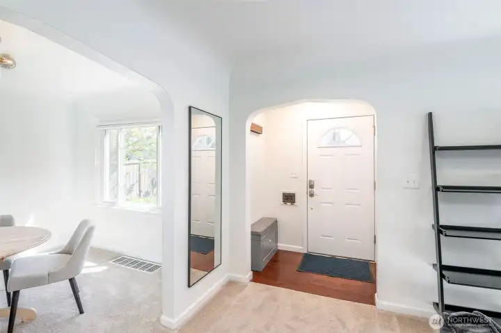Interior view of the stylish main entry with the living room & dining room off to each side.