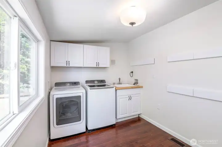 Large laundry room conveniently located off the rear entry.