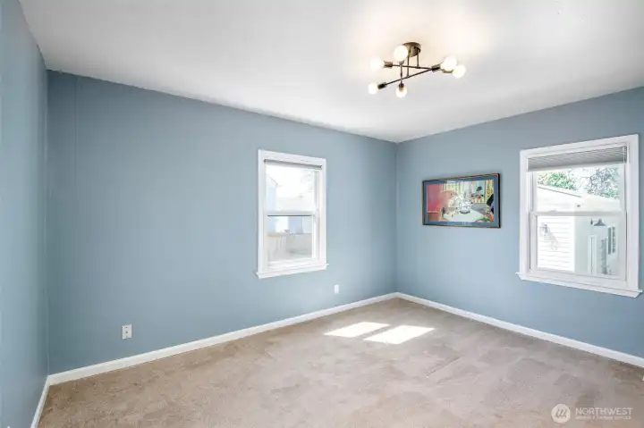 Primary Bedroom with great windows for SW afternoon/evening sunlight on Main Floor [Full Bath = Shower, Tub, Toilet, Double Vanity]. Insulated Windows. HVAC provides year round comfort.