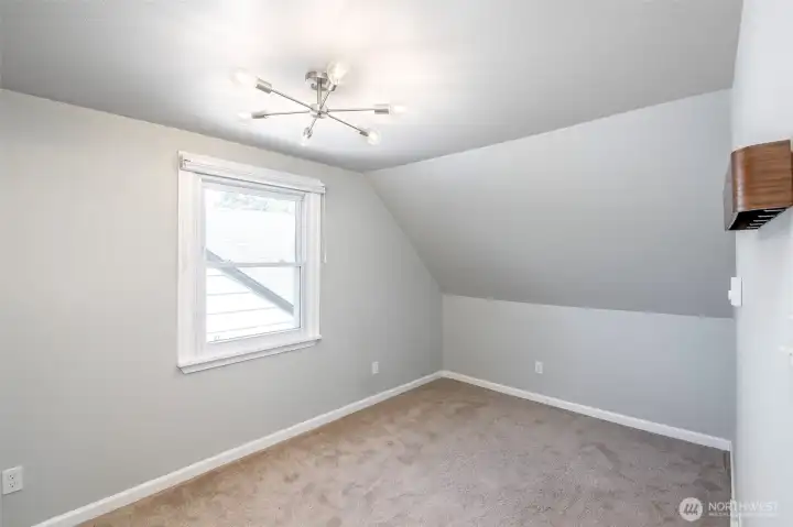 1 of 2 upper bedrooms, with common bath/shower just a step away.