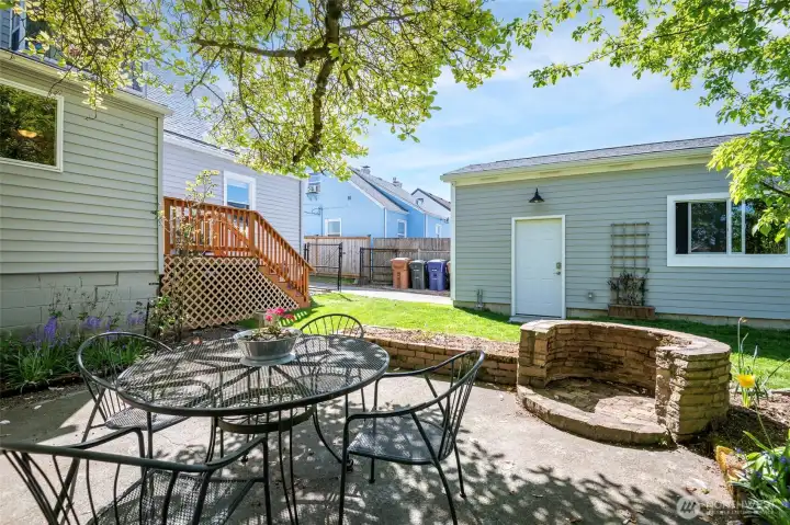 View from patio toward side access door on garage.