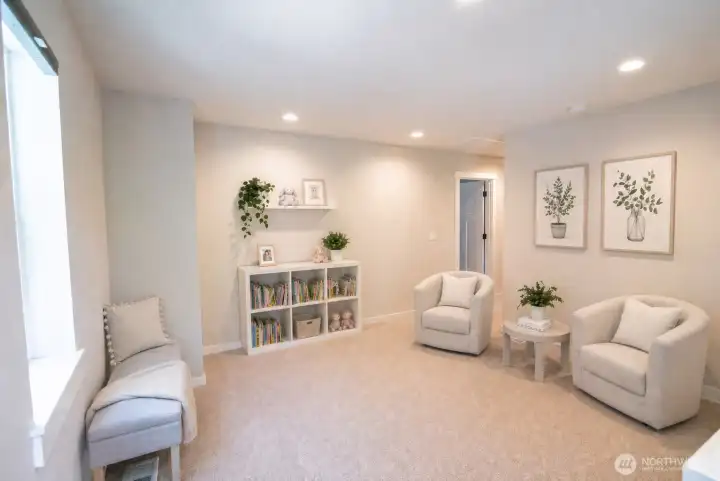 Virtually staged upstairs second living space for reading, play, gym equipment, etc.